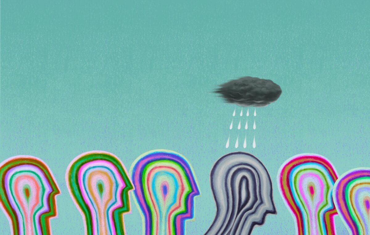 The outline of six multicoloured heads, with one in the middle being grey and having a rain cloud overhead